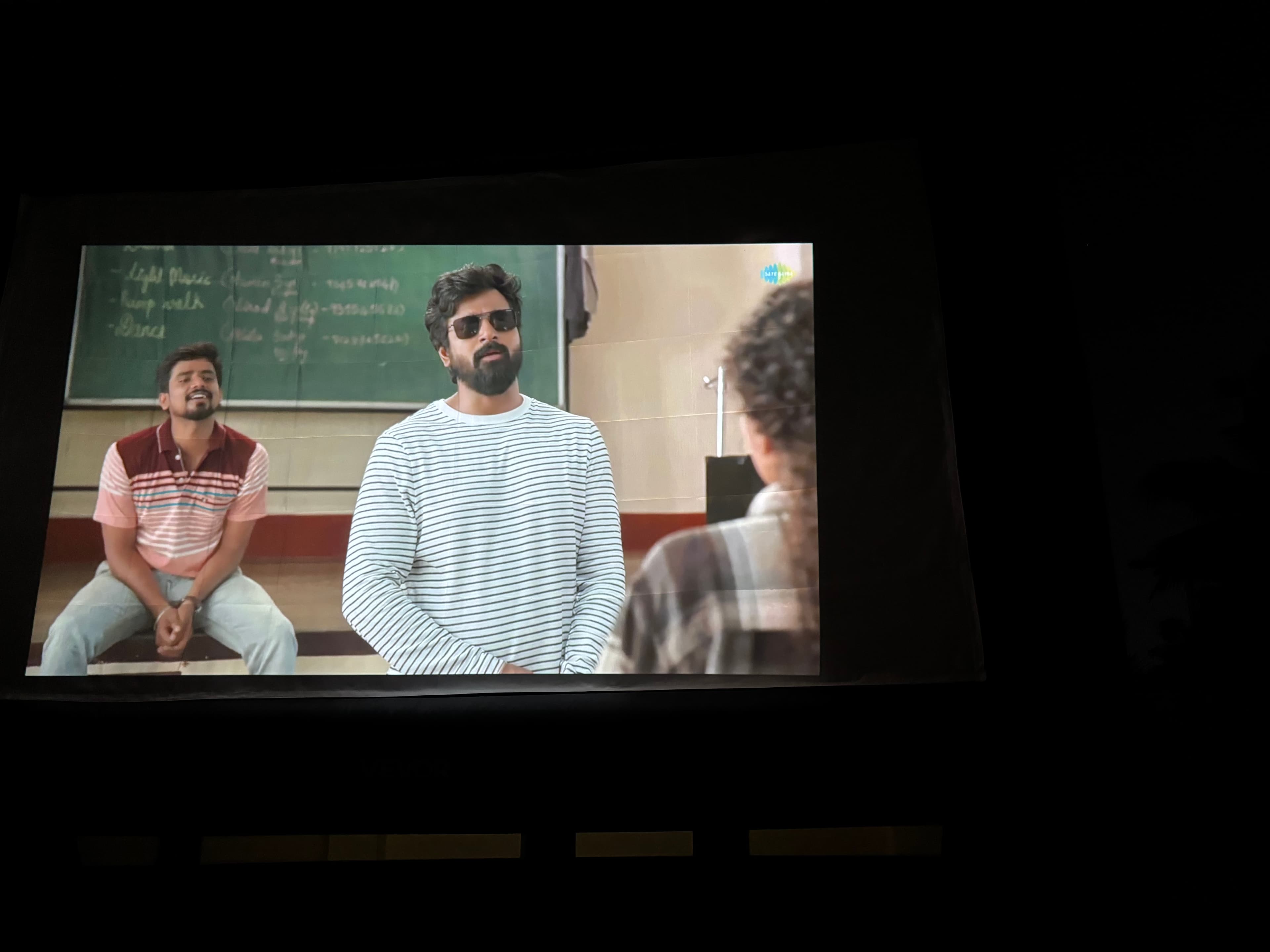 Movie screening on inflatable screen — close-up of projected film